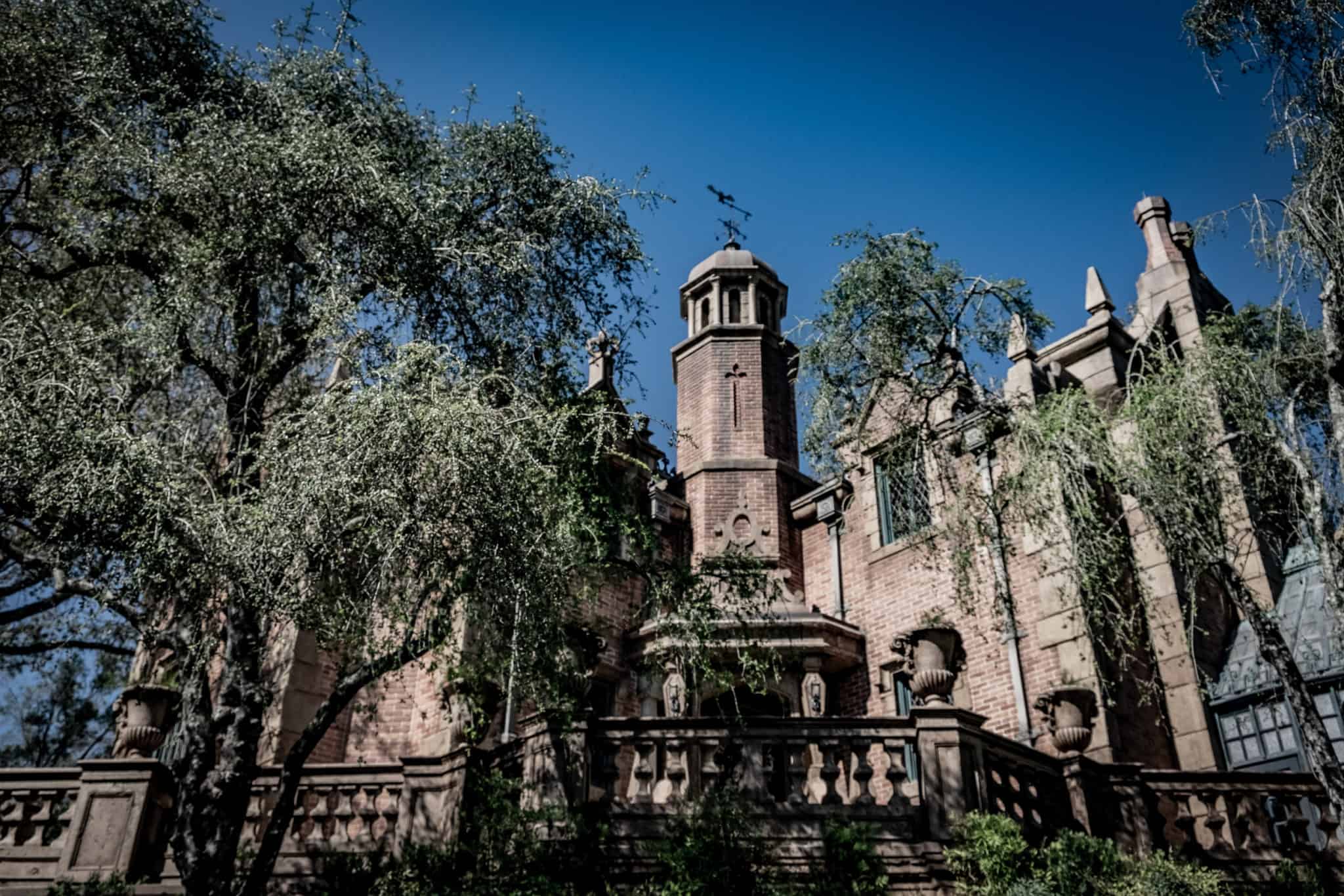 The Haunted Mansion exterior in Liberty Square by day